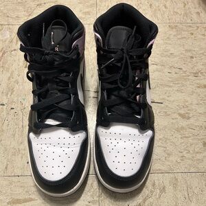 White and purpleish Nike high top shoes